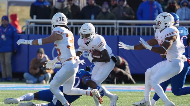 Texas wide receiver Xavier Worthy (8) carries the ball against Kansas during their game in on Saturday, Nov. 19, 2022.